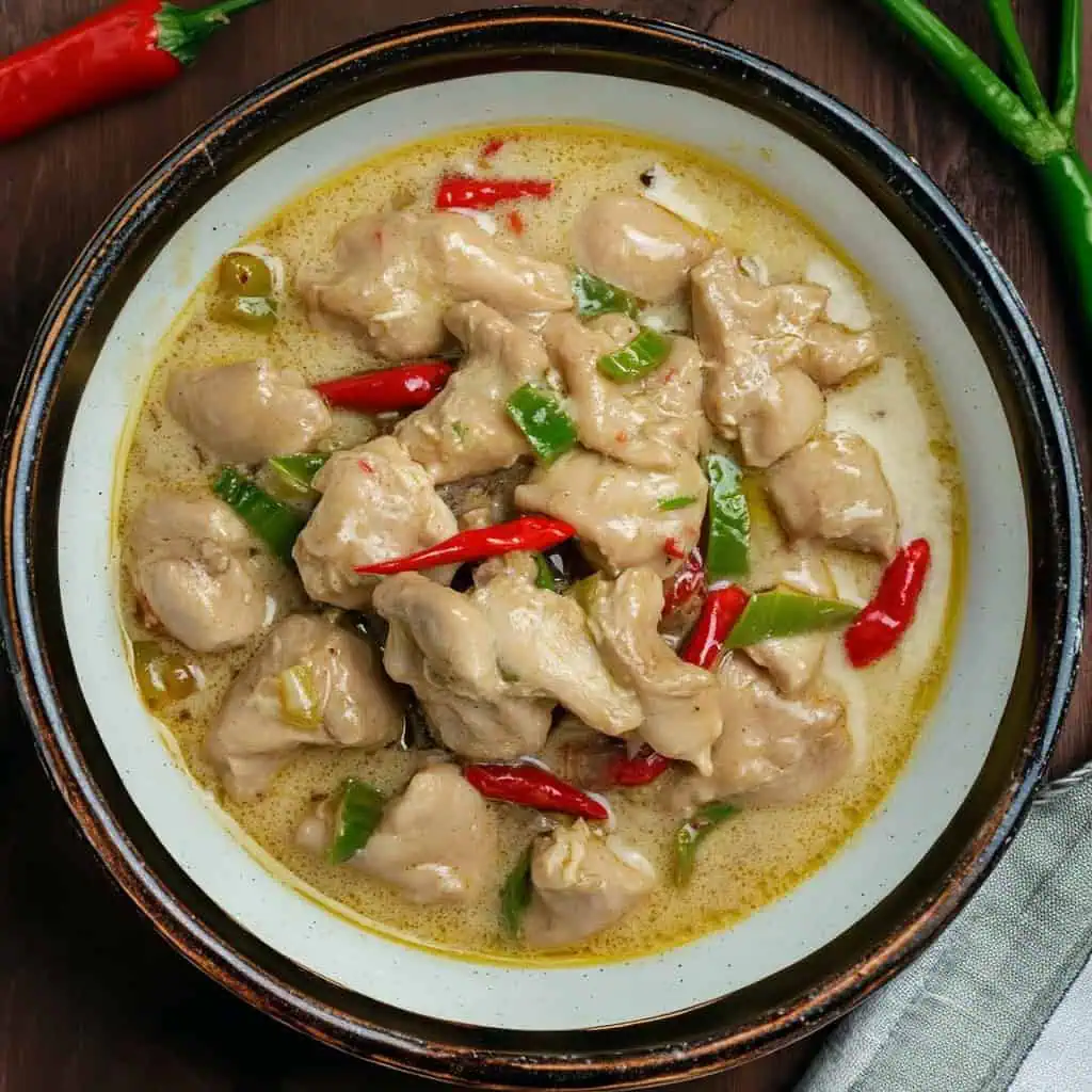 Discover our Chicken Bicol Express recipe - a healthier twist on the classic Filipino dish! Tender chicken simmered in creamy coconut milk with spicy chilies and shrimp paste. Ready in 50 minutes, perfect for family dinners. Learn how to make this budget-friendly, spicy comfort food with authentic Bicolano flavors.