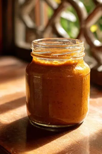 ## **The Story Behind Coco Jam** Coco jam, or "minatamis na bao" as it's known in the Philippines, has its roots deeply planted in Filipino culinary tradition spanning centuries. The name itself tells the story - "minatamis" means "to make sweet" and "bao" refers to coconut, though it literally translates to coconut shell. This sweet coconut spread emerged from the practical need to preserve the abundant coconut harvest that blessed the Philippine archipelago year-round. Long before refrigeration existed, Filipino families discovered that cooking fresh coconut cream with native palm sugar created a shelf-stable preserve that could last for weeks. This technique allowed them to enjoy the rich taste of coconut long after the fresh supply had been consumed. The slow cooking process not only preserved the coconut but transformed it into something even more delicious - a creamy, caramel-colored jam that became a household staple. Regional variations of coco jam exist throughout the Philippines, each with its own local twist. In the Visayas region, this same preparation is often called "soft latik," which can confuse newcomers to Filipino cuisine since "latik" also refers to the crispy coconut curds used as a topping. The Luzon provinces, particularly in areas like Bataan and Laguna where coconuts grow abundantly, have perfected the art of making coco jam as a daily breakfast companion. Traditional Filipino breakfast wouldn't be complete without freshly baked pandesal and a generous spread of homemade coco jam. This combination has nourished Filipino families for generations, providing the energy needed for long days of work while satisfying the Filipino palate's love for sweet flavors. The practice of making coco jam was typically passed down from grandmother to granddaughter, with each family guarding their own special techniques for achieving the perfect consistency and color. Today, while commercial versions of coco jam are readily available in Filipino grocery stores and even internationally, many families still prefer the homemade version for its superior taste and the satisfaction of continuing this cherished culinary tradition. The beauty of authentic coco jam lies in its simplicity - just two ingredients transformed through patience and care into a spread that captures the essence of Filipino comfort food.